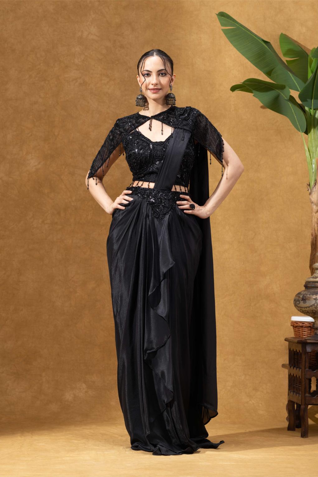 Elegant Black Saree with Statement Shoulder Cape