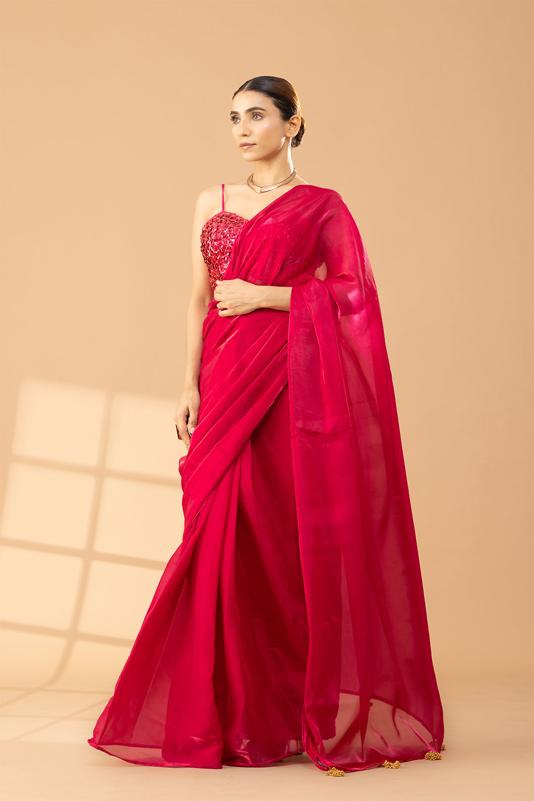 Cherry Shimmer Saree with Gold Tassels