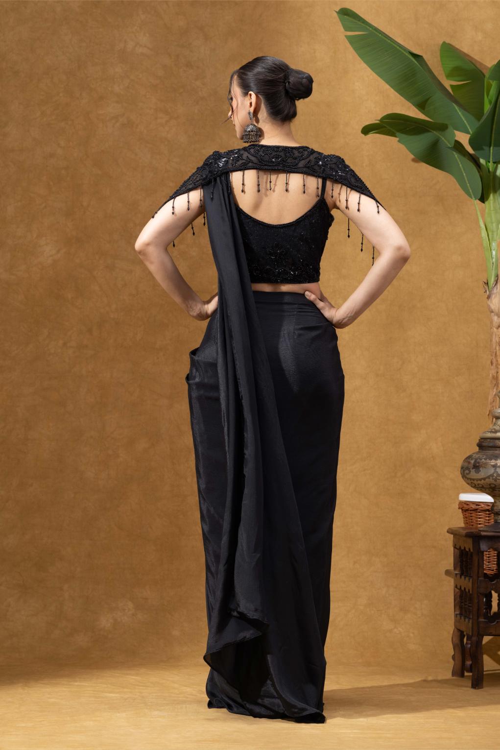 Elegant Black Saree with Statement Shoulder Cape