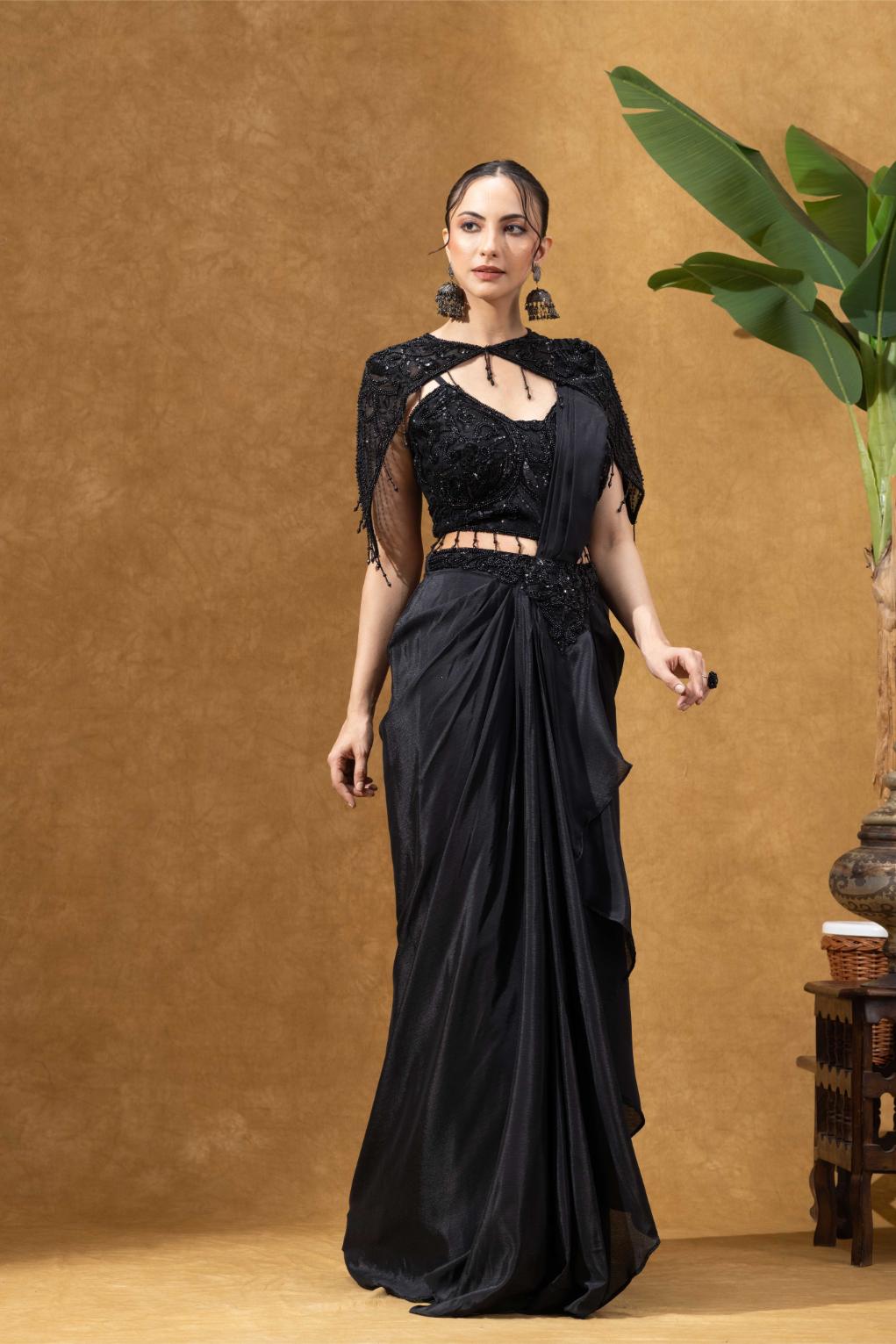 Elegant Black Saree with Statement Shoulder Cape