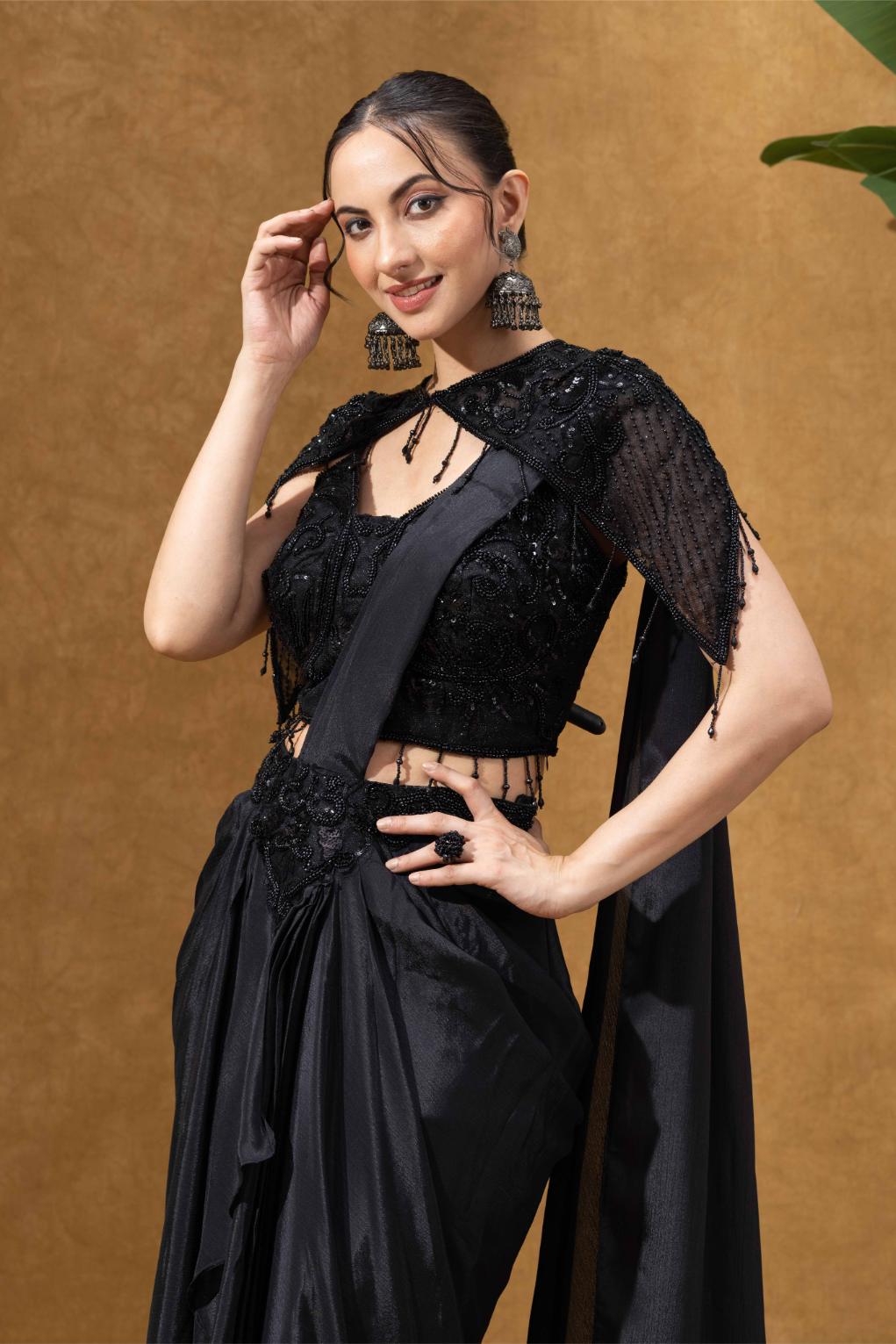 Elegant Black Saree with Statement Shoulder Cape