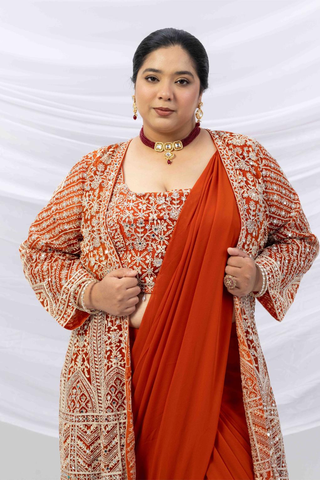 Rust Gold Draped Saree with Heavy Embroidered Shrug &amp; Blouse